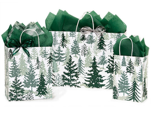 three bags of different sizes with snowy pine trees on them