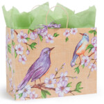 Prime Gift bag with a bird and flower on it with purple tissue.